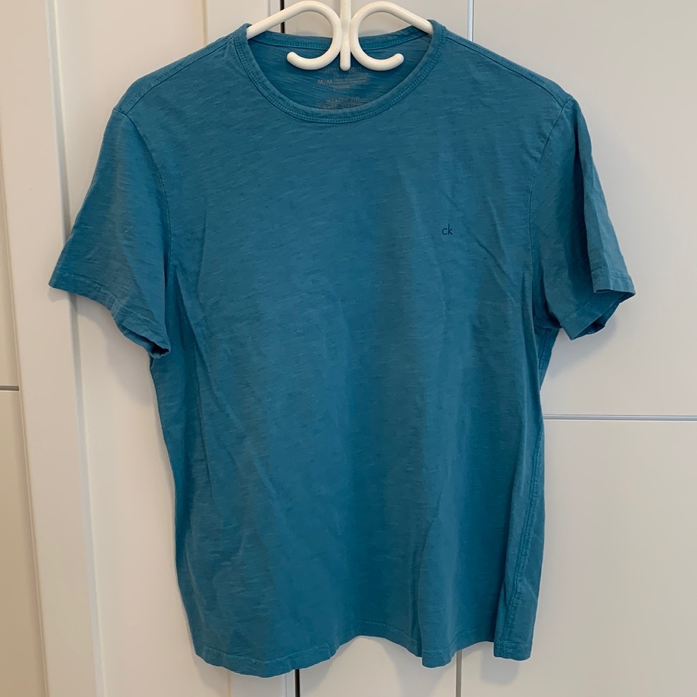 ** Calvin Klein blue tee